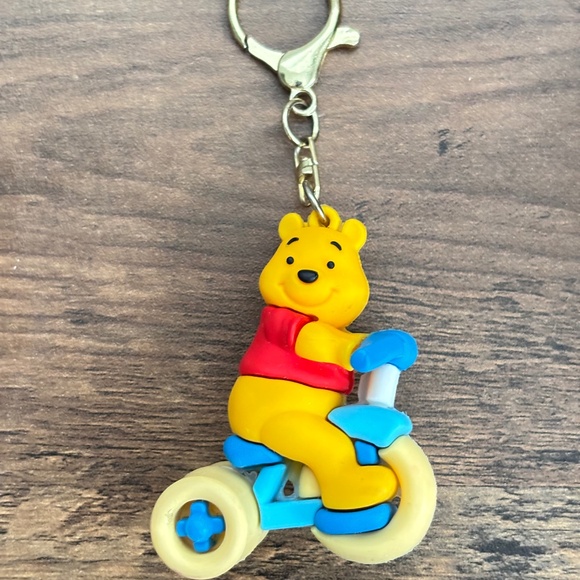 DISNEY Rubber & Metal Keychain Backpack Bag Clip WINNIE THE POOH Riding A Bike - Picture 2 of 9